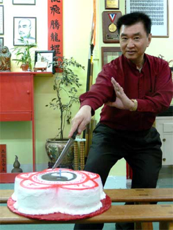 GM cutting the cake with kung fu style